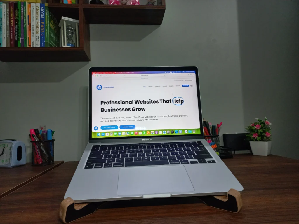 MacBook Pro showing the KodersKube website homepage in a web browser